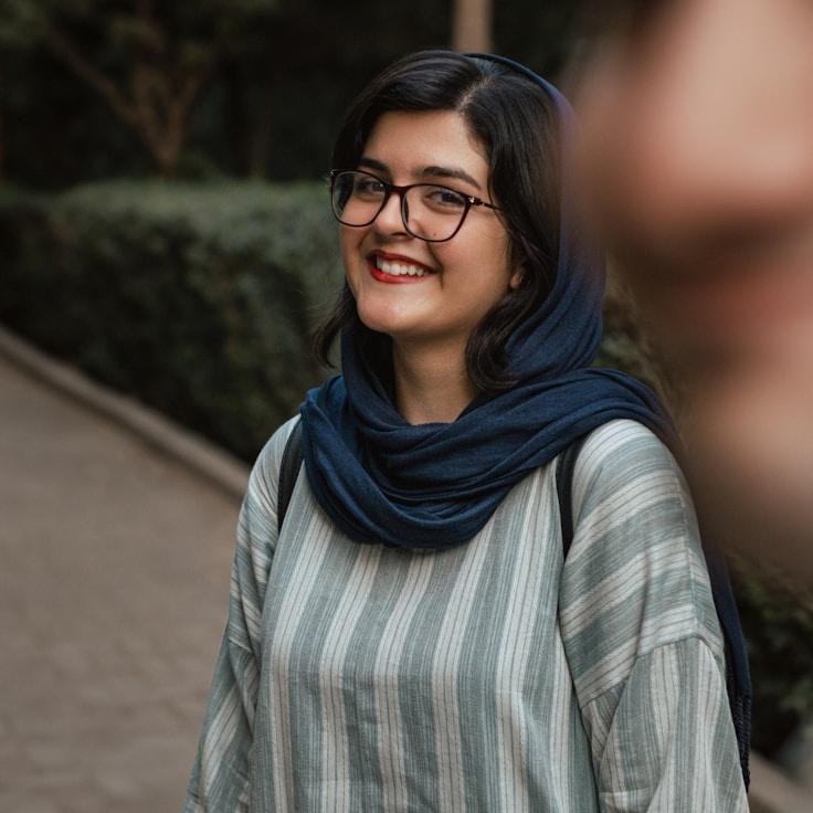 Kaveri Mehta, Lead Design Curator at Golden Window Leaf, reviewing corporate floral arrangements